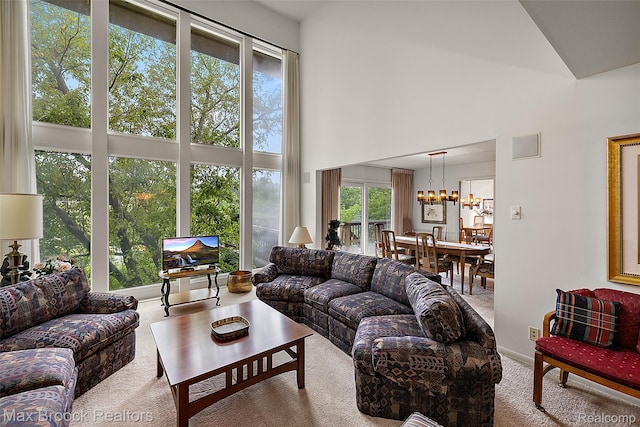 3350 Franklin Rd, Bloomfield Hills, MI 48302 - living room with high vaulted ceiling, carpet flooring, and a chandelier