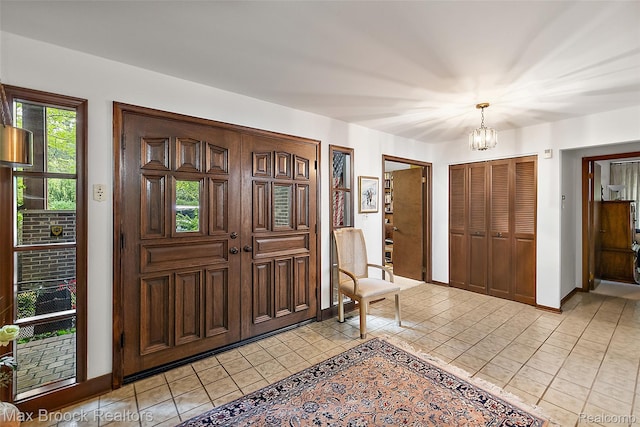 3350 Franklin Rd, Bloomfield Hills, MI 48302 - entryway featuring a chandelier and light tile patterned flooring
