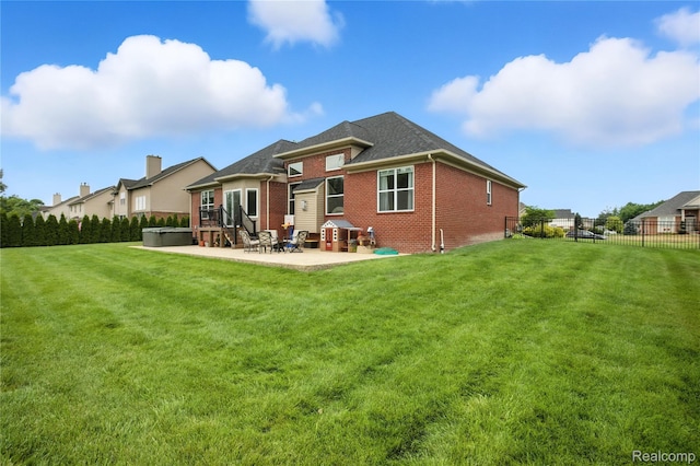 27245 Ritter Blvd, Flat Rock, MI 48134 - rear view of property with brick siding and a patio area