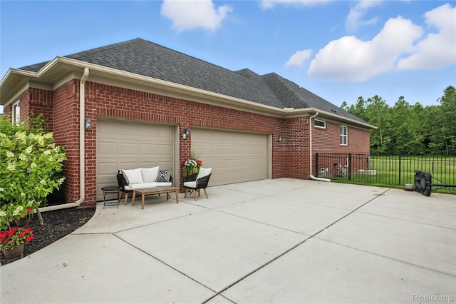 27245 Ritter Blvd, Flat Rock, MI 48134 - view of property exterior with brick siding, driveway, a shingled roof, and a garage