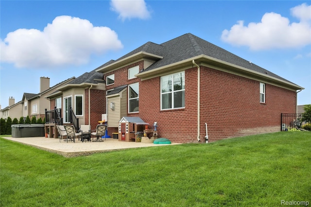 27245 Ritter Blvd, Flat Rock, MI 48134 - rear view of property with brick siding, a patio area, a lawn, and a shingled roof