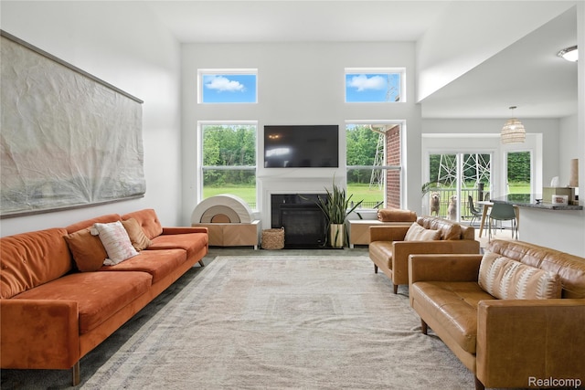27245 Ritter Blvd, Flat Rock, MI 48134 - living area featuring a glass covered fireplace and a high ceiling
