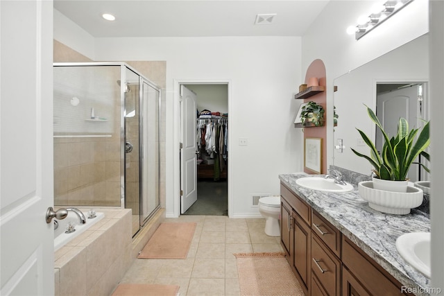 27245 Ritter Blvd, Flat Rock, MI 48134 - full bathroom featuring double vanity, a stall shower, a garden tub, and tile patterned flooring