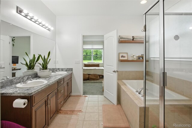 27245 Ritter Blvd, Flat Rock, MI 48134 - full bath with connected bathroom, double vanity, a garden tub, tile patterned floors, and an enclosed shower