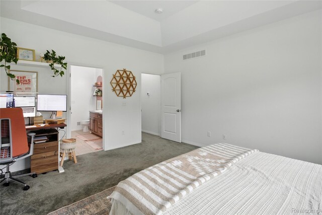 27245 Ritter Blvd, Flat Rock, MI 48134 - bedroom with light carpet, a towering ceiling, ensuite bath, and a desk
