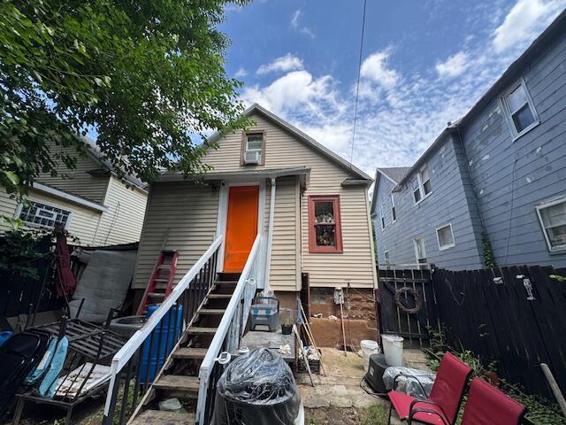 908 Hall St SE, Grand Rapids, MI 49507 - view of front of house featuring a fenced backyard and entry steps