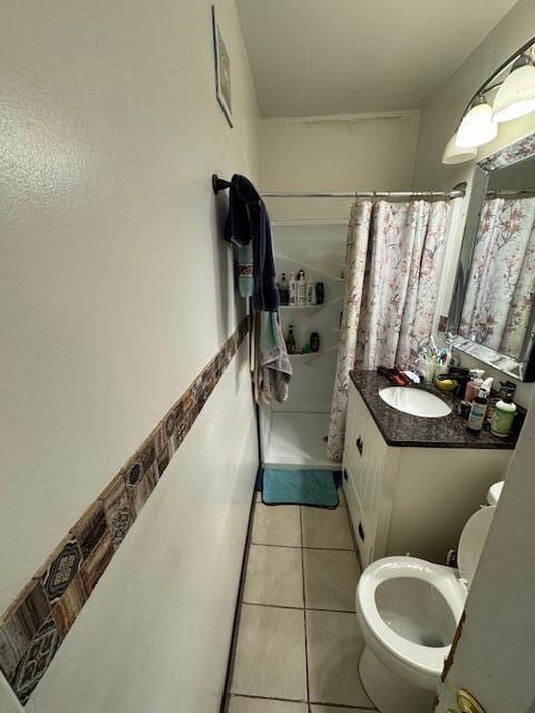 908 Hall St SE, Grand Rapids, MI 49507 - full bath featuring a stall shower, tile patterned floors, and vanity
