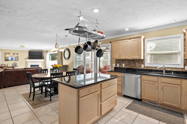 16069 Grazenview St, Schoolcraft, MI 49087 - kitchen with stainless steel dishwasher, light brown cabinetry, ornamental molding, plenty of natural light, and a textured ceiling