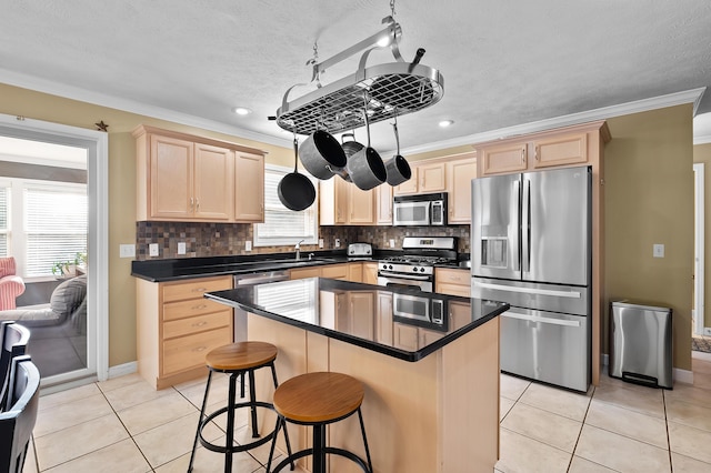 16069 Grazenview St, Schoolcraft, MI 49087 - kitchen with appliances with stainless steel finishes, light brown cabinetry, ornamental molding, light tile patterned floors, and tasteful backsplash