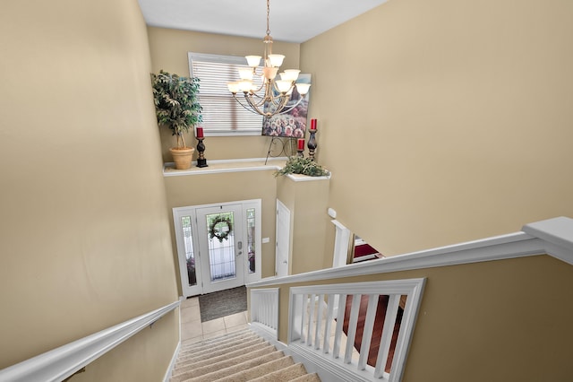 16069 Grazenview St, Schoolcraft, MI 49087 - stairs with a chandelier, plenty of natural light, and tile patterned flooring