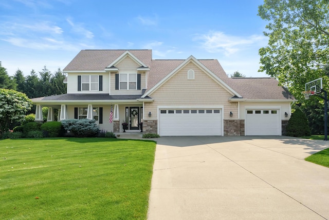 16069 Grazenview St, Schoolcraft, MI 49087 - craftsman-style house with stone siding, a front lawn, concrete driveway, an attached garage, and covered porch