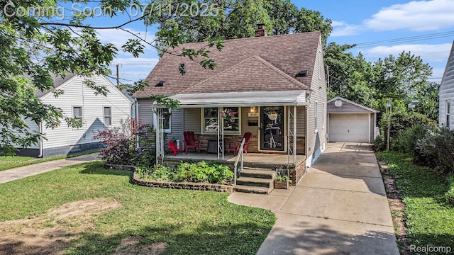 32247 Annapolis St, Wayne, MI 48184 - view of front of property featuring covered porch, an outdoor structure, driveway, a detached garage, and a front lawn
