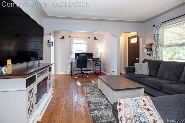 32247 Annapolis St, Wayne, MI 48184 - living room with arched walkways, wood-type flooring, and an office area