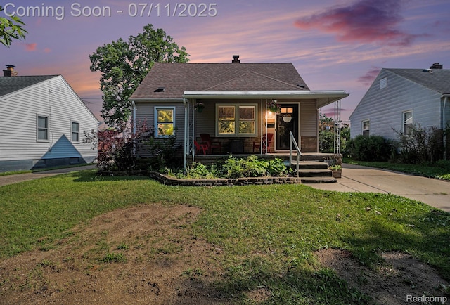 32247 Annapolis St, Wayne, MI 48184 - bungalow with a porch, a front lawn, and a shingled roof