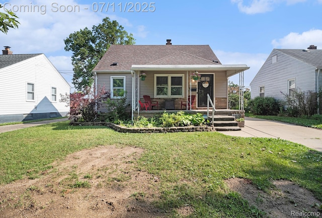 32247 Annapolis St, Wayne, MI 48184 - bungalow-style house with a porch, a front yard, a shingled roof, and a chimney