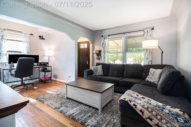 32247 Annapolis St, Wayne, MI 48184 - living room with arched walkways, hardwood / wood-style flooring, and a desk