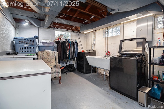 32247 Annapolis St, Wayne, MI 48184 - below grade area with washer and clothes dryer, electric panel, and refrigerator