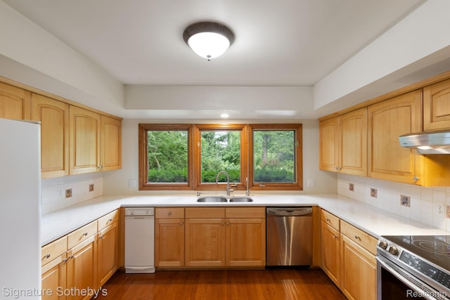 26311 W 14 Mile Rd, Franklin, MI 48025 - kitchen featuring stainless steel appliances, under cabinet range hood, healthy amount of natural light, and backsplash