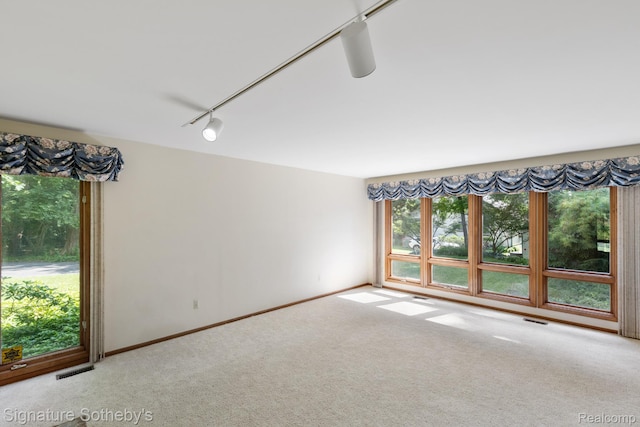 26311 W 14 Mile Rd, Franklin, MI 48025 - unfurnished room featuring carpet floors and rail lighting