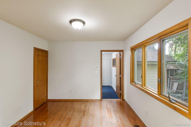 26311 W 14 Mile Rd, Franklin, MI 48025 - spare room with light wood-type flooring and baseboards