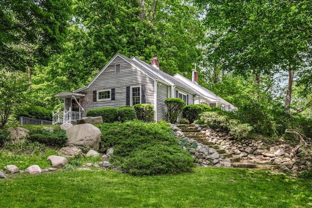 5515 Kaiser Rd, Sawyer, MI 49125 - view of front of house featuring a chimney and a front lawn
