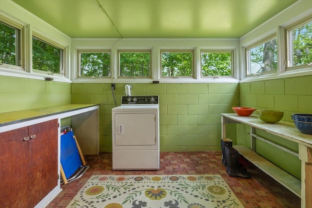 5515 Kaiser Rd, Sawyer, MI 49125 - washroom with washer / clothes dryer, brick patterned floors, and cabinet space