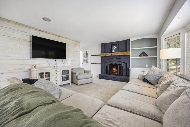 1440 Chevelle, Jenison, MI 49428 - living area with a fireplace, carpet flooring, wood walls, and built in shelves
