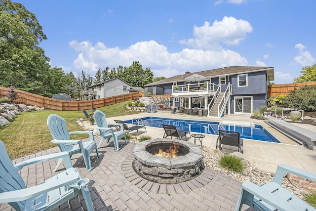1440 Chevelle, Jenison, MI 49428 - view of swimming pool with an outdoor fire pit, stairway, a fenced backyard, and a patio area