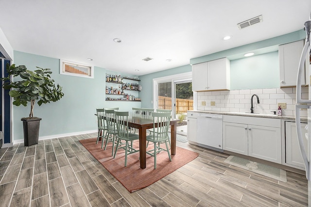 1440 Chevelle, Jenison, MI 49428 - dining space featuring light wood-style flooring, recessed lighting, and a dry bar