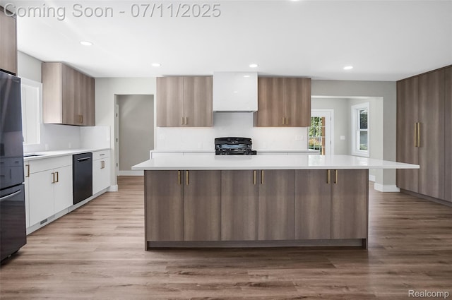22222 Evergreen St, Macomb, MI 48082 - kitchen with range, black dishwasher, modern cabinets, light countertops, and recessed lighting