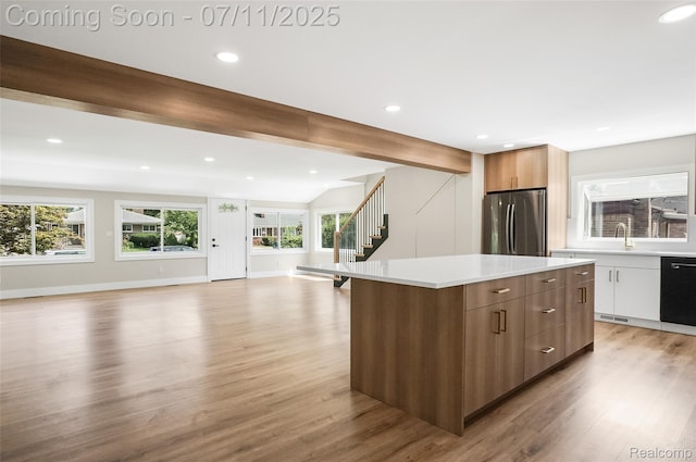 22222 Evergreen St, Macomb, MI 48082 - kitchen with freestanding refrigerator, modern cabinets, light wood-style floors, dishwasher, and recessed lighting