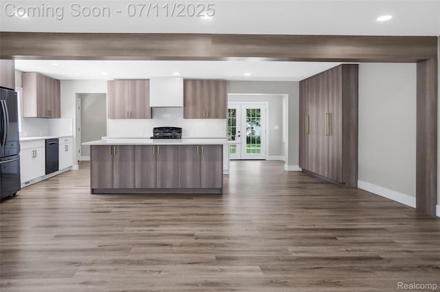 22222 Evergreen St, Macomb, MI 48082 - kitchen with range, dishwasher, modern cabinets, light countertops, and wood finished floors