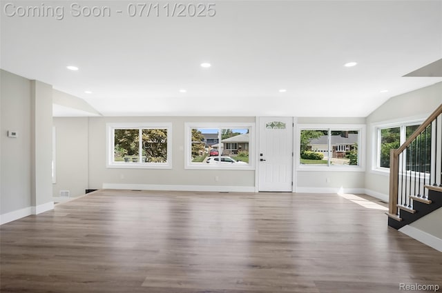 22222 Evergreen St, Macomb, MI 48082 - unfurnished living room with vaulted ceiling, stairway, wood finished floors, and recessed lighting