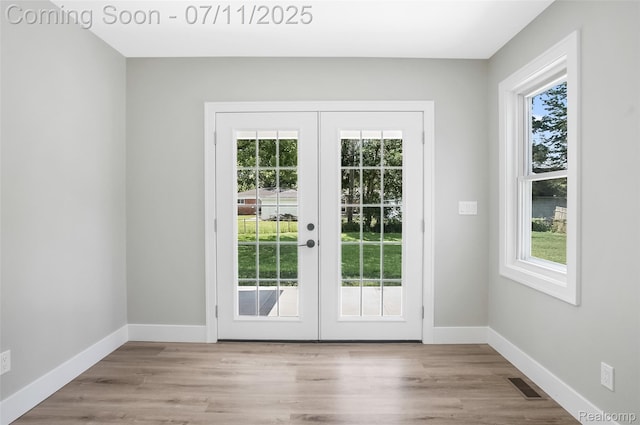 22222 Evergreen St, Macomb, MI 48082 - entryway featuring french doors, plenty of natural light, and wood finished floors