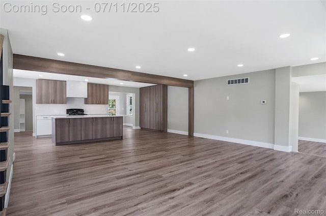 22222 Evergreen St, Macomb, MI 48082 - unfurnished living room featuring recessed lighting and wood finished floors
