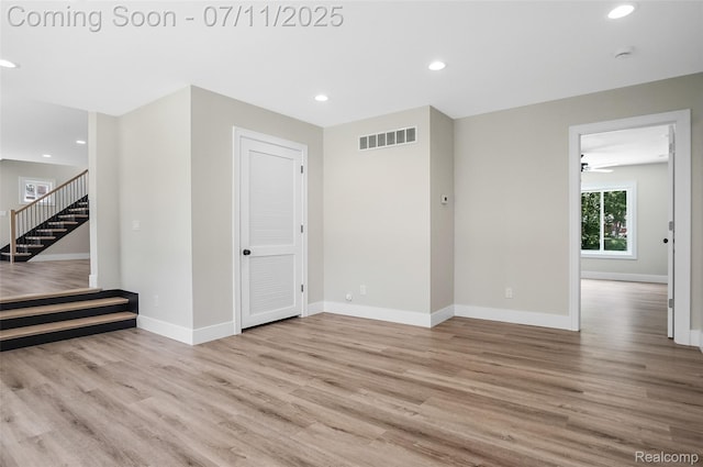 22222 Evergreen St, Macomb, MI 48082 - unfurnished room with wood finished floors, stairway, recessed lighting, a smoke detector, and ceiling fan