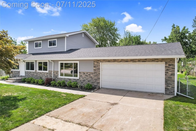 22222 Evergreen St, Macomb, MI 48082 - view of front facade with an attached garage, stone siding, concrete driveway, and roof with shingles