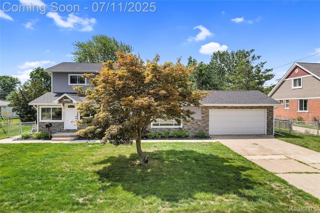 22222 Evergreen St, Macomb, MI 48082 - view of front of property featuring driveway, a garage, and stone siding