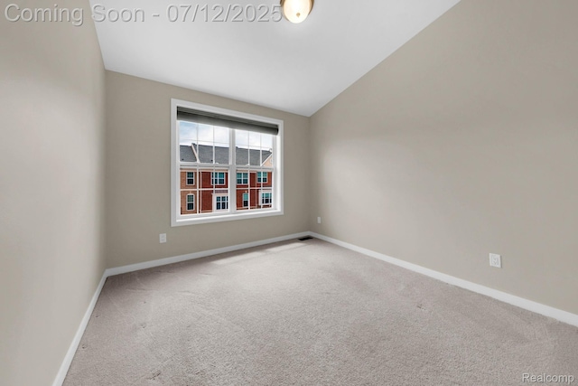 2825 Ridington Rd, Ann Arbor, MI 48105 - spare room featuring carpet flooring and lofted ceiling