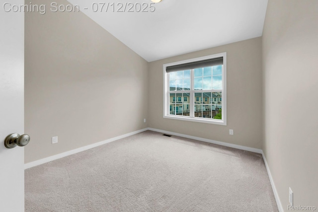 2825 Ridington Rd, Ann Arbor, MI 48105 - carpeted empty room with vaulted ceiling and baseboards