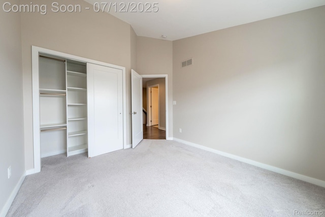 2825 Ridington Rd, Ann Arbor, MI 48105 - unfurnished bedroom with carpet floors, a closet, and high vaulted ceiling
