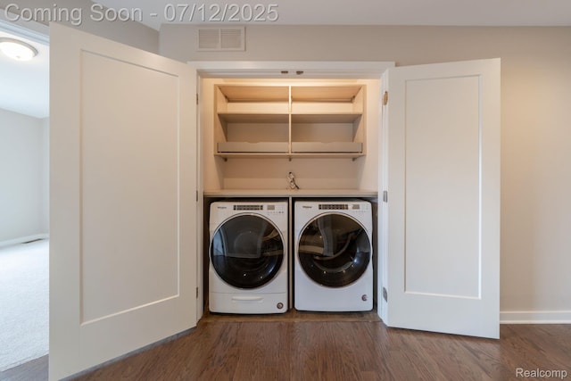 2825 Ridington Rd, Ann Arbor, MI 48105 - laundry area featuring washer and clothes dryer and dark wood-type flooring