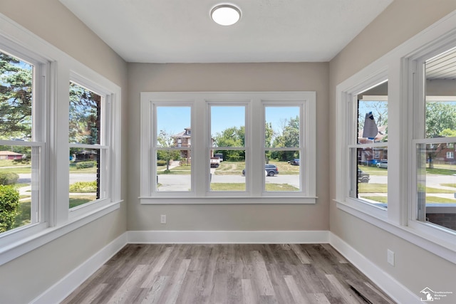 2651 Lakewood St, Detroit, MI 48215 - unfurnished sunroom with healthy amount of natural light and wood finished floors