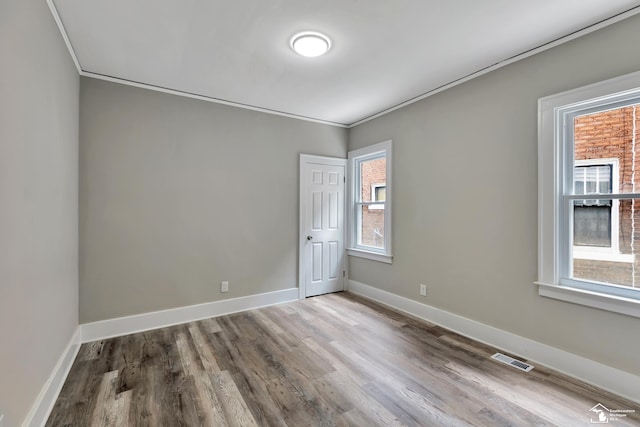 2651 Lakewood St, Detroit, MI 48215 - empty room featuring ornamental molding and wood finished floors
