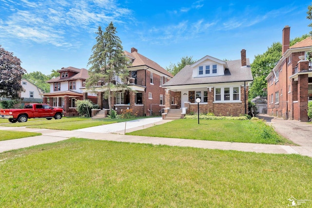 2651 Lakewood St, Detroit, MI 48215 - view of front of property featuring a front lawn and a chimney