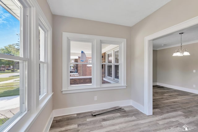 2651 Lakewood St, Detroit, MI 48215 - unfurnished dining area featuring a chandelier and wood finished floors