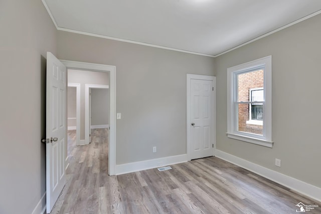 2651 Lakewood St, Detroit, MI 48215 - unfurnished room featuring ornamental molding and light wood-style floors