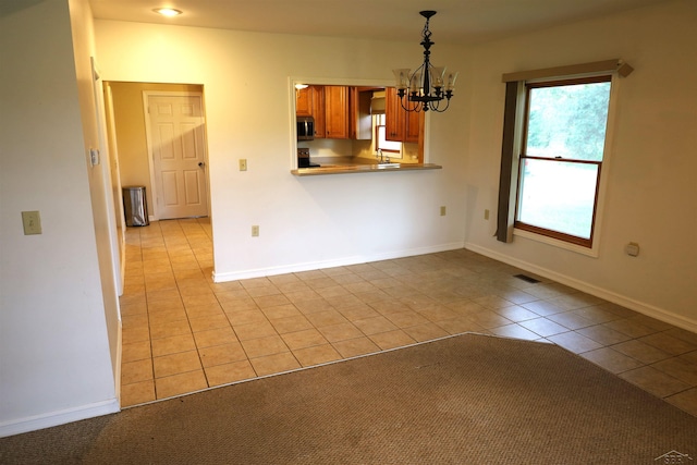11731 Birch Run Rd, Birch Run, MI 48415 - unfurnished dining area featuring a chandelier and light tile patterned floors