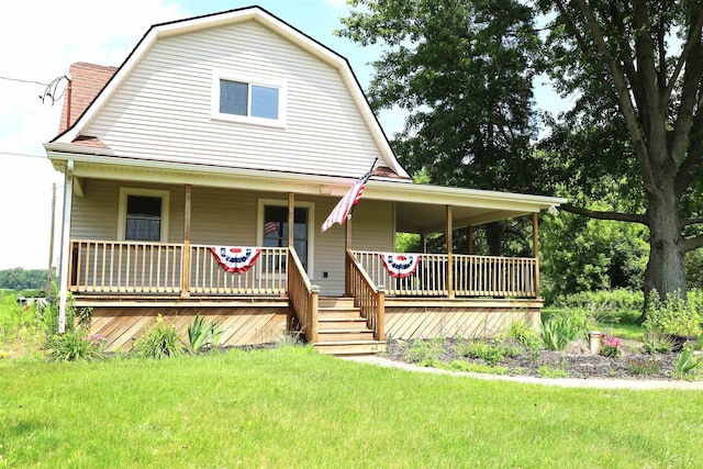11731 Birch Run Rd, Birch Run, MI 48415 - view of front of property featuring a gambrel roof, a porch, and a front lawn