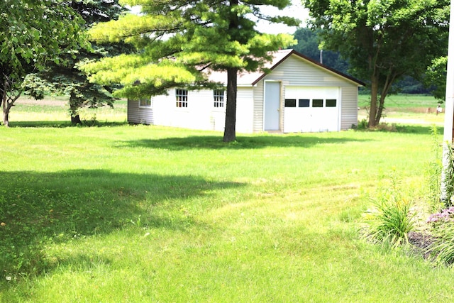 11731 Birch Run Rd, Birch Run, MI 48415 - view of green lawn with a garage and an outdoor structure